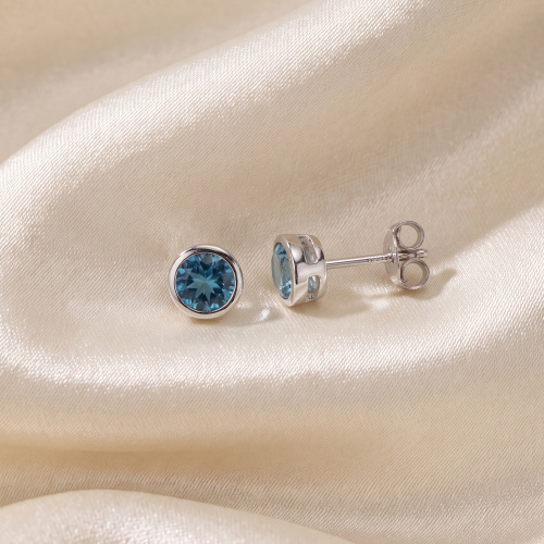 Preview: Ohrstecker rund 925 Sterling Silber rhodiniert 2 Zirkonia hellblau blau Ohrringe
